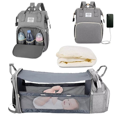 🎒 תיק חיתולים 3 ב-1 – תיק גב + מיטה ניידת + תחנת טעינה