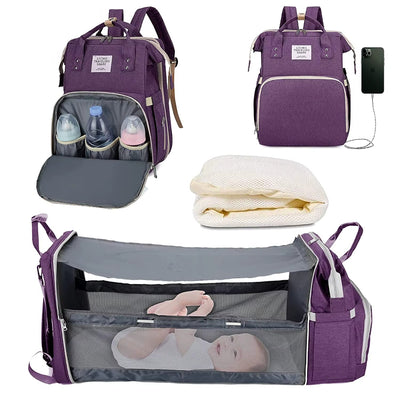 🎒 תיק חיתולים 3 ב-1 – תיק גב + מיטה ניידת + תחנת טעינה